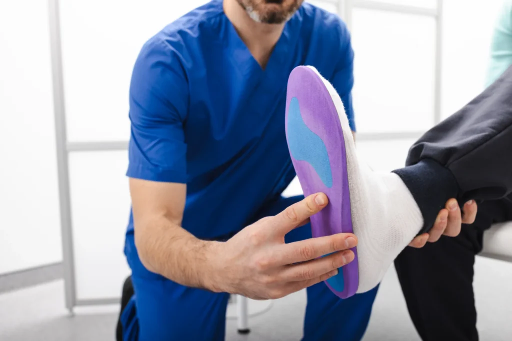 adult male applying insole in medical office 2026 03 25 10 38 32 utc