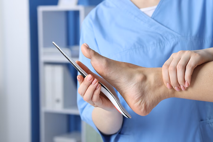 doctor fitting insole to patient s foot in hospita 2026 01 11 11 08 32 utc converted