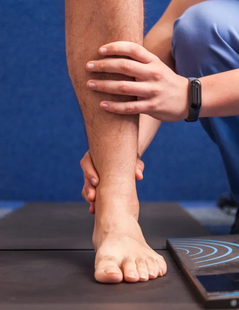 examining a patient s leg and foot in clinic 2026 03 16 23 44 19 utc e1780373338421