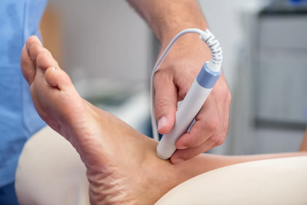 hand using a medical device on patient ankle 2026 03 17 05 05 27 utc